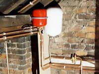 Hot water cylinder fitted in loft area.