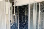 New shower cubicle installation with water boards.
