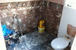 A new bathroom showing the before state - an empty shell