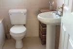 Bathroom showing the newly installed wash hand basin and toilet