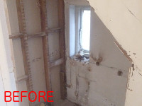 Understairs cupboard converted into a bathroom.