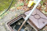 Our members of staff unblocking a drain for a primary school in Aigburth.