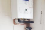 Replacement and reallocation of boiler from a dangerous postion in the property.