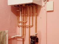 Boiler installation on a very pink wall!