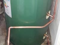 Hot water cylinder with immersions.