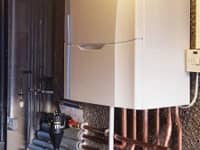 Ideal Vogue boiler installation with a vertical flue.