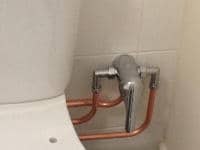 Toilet bidet installation showing controls.