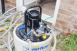 Power flushing a central heating system to remove sludge and blockages